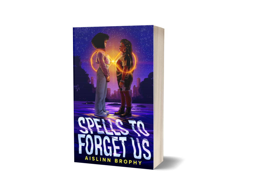 The cover for Spells to Forget Us by Aislinn Brophy. The cover shows two Black girls, one with lighter skin and fluffy curly hair, and the other with darker skin, locs, and an all black outfit. They stand on a river looking at each other, with their hearts connected with a beam of orange light. The orange light sweeps around them in an infinity symbol. Behind them is a dark, starry sky and the Boston skyline. A dark silhouette of a dragon swims in the water in the distance. 